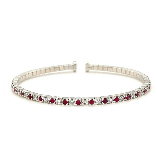 Eternity Flex Tennis Bracelet in 18k White Gold with 1.55ct Ruby and 1.02ct Diamonds - A radiant and flexible accessory that effortlessly combines style and comfort, perfect for day-to-night wear. The lustrous metal setting enhances the brilliance of gemstones, creating a cohesive and timeless aesthetic. Versatile and elegant, it complements any ensemble as a standalone statement or layered for a personalized look.
