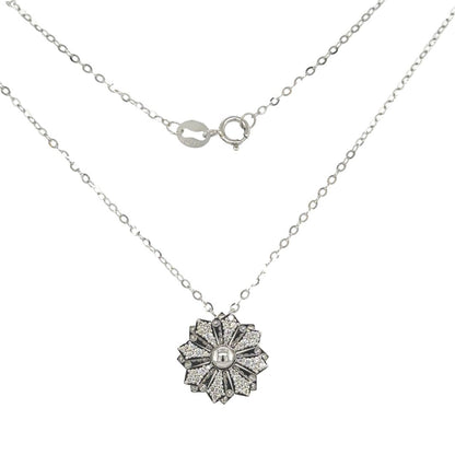 Snowflake Duo Pendant - Two intricately designed snowflakes in 18k white gold with glistening diamonds.